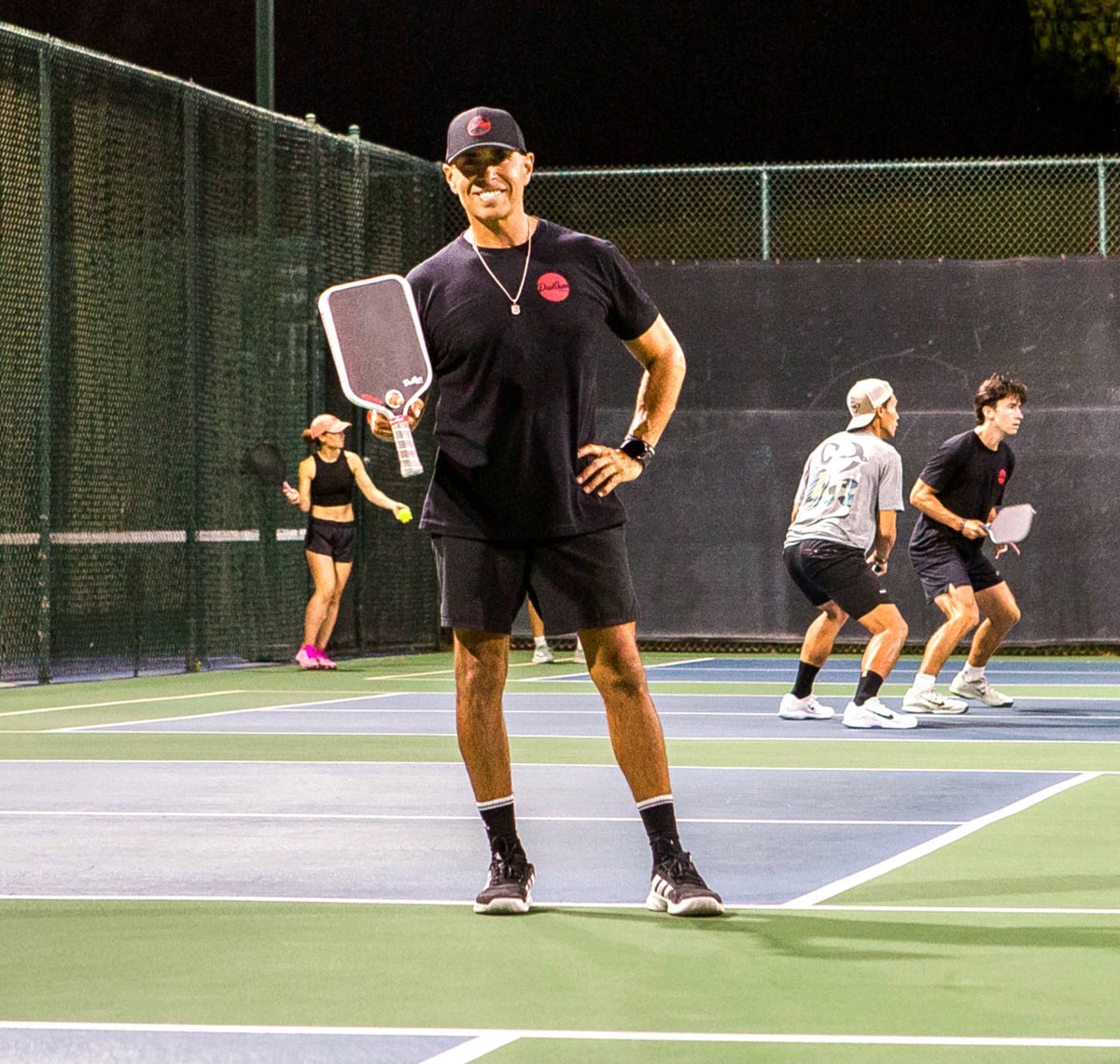 A Bakersfield Ballers player holding his paddle during a night match